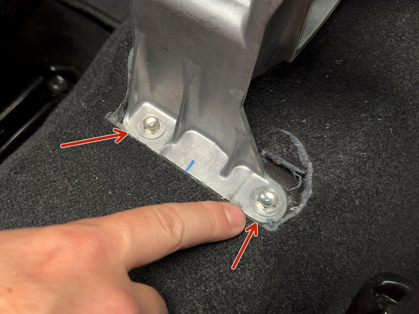 There are four 10mm bolts that hold the aluminum shifter base to the chassis.