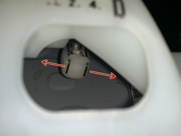 Use your fingers to seperate the clip on the RH side shifter cable. Push them up and apart and the cable end link will slide off the ball.