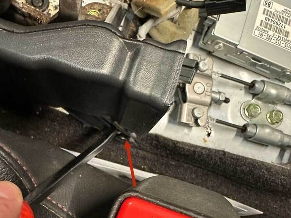 Slide the driver's side AC vent back and out of the center of the car.