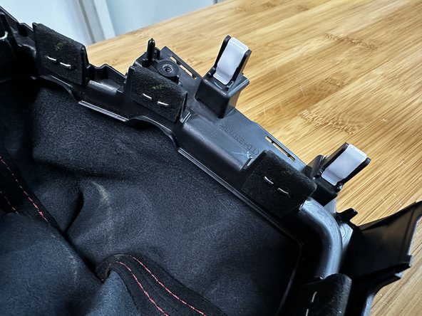 You must remove all of the staples before you are able to remove the shift boot.