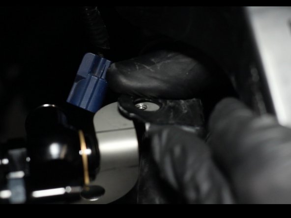 Bend the heat hose pipe mounting tab back into place and install the factory mounting bracket.