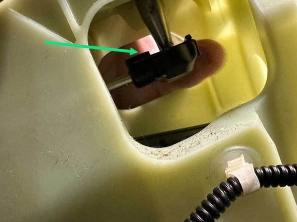 The front back cable end is held on with a spring clip. Pull it down to release it from the ball on the bottom of the shifter.