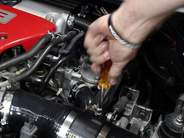 Install and tighten the valve cover breather tube.