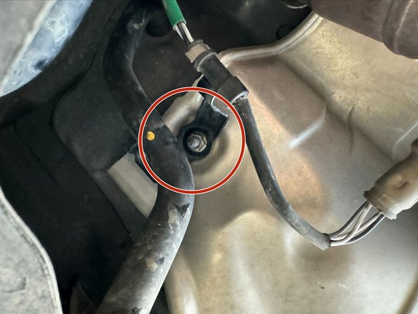 Use 10mm Socket to remove x3 Nuts holding Heat-Shield to Chassis.