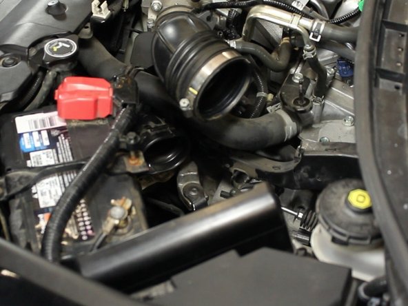 Remove the lower air tube by squeezing the end and pulling upwards.