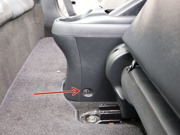 Slide your seats forward and use a magnetic screw driver.