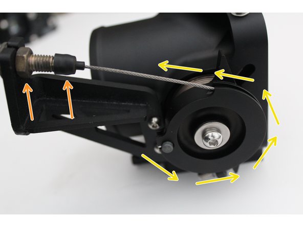 Insert the cable into the throttle body rotor groove so the cable is in line with the mounting bracket.