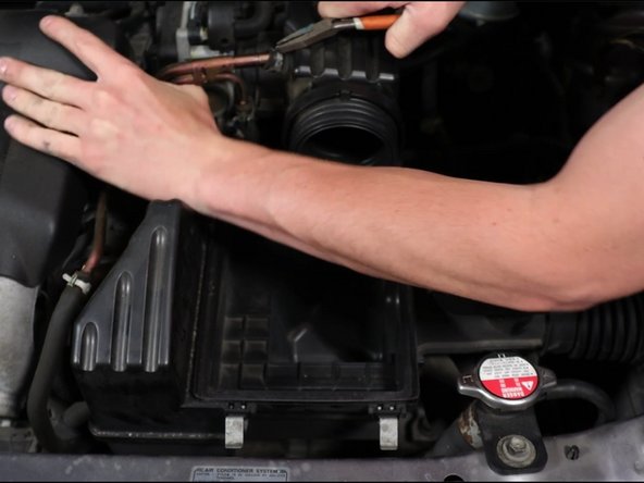 Unbolt the airbox and remove it.