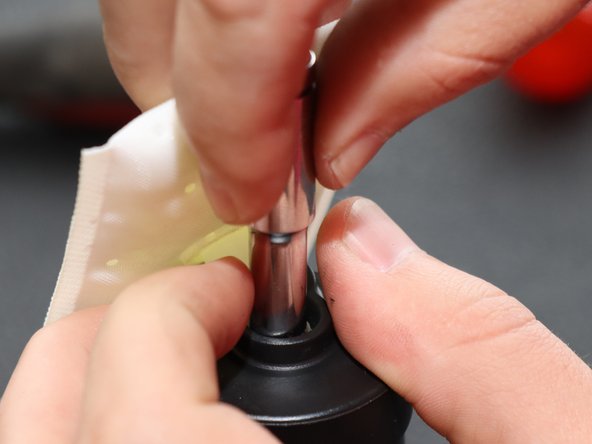 Use a small 6mm socket to hold the clip in place and tap it downward with a hammer to secure it.