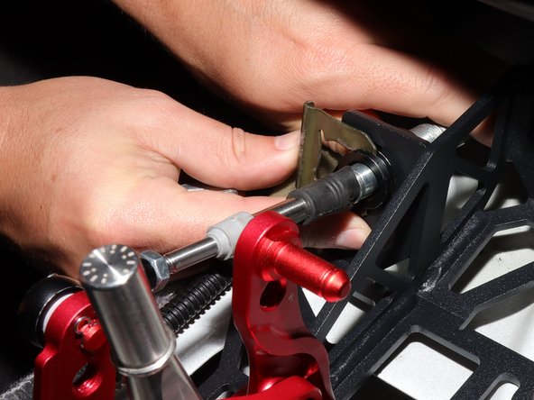 Install the spring C clip to hold the shifter cable to the shifter.