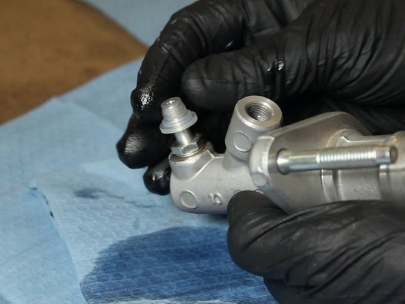 Cap the fluid outlet on the EM1 CMC.