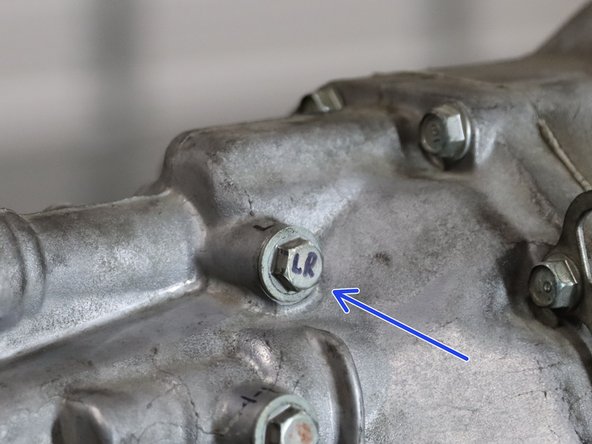 On the RH side of the transmission case, you will find the Left/Right detent spring. This is the ONLY location where the BLACK SPRING should be installed. It is specifically made to go in this location. Find the only BLACK spring and install it here. This will increase the stiffness when you move the shift lever LEFT-RIGHT.