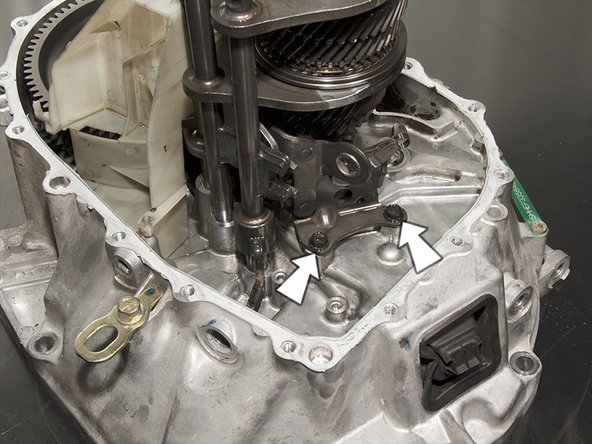 Unbolt and remove the reverse shift fork using a 10mm socket.