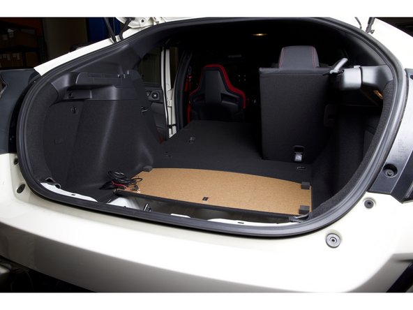 Fold the rear seat down to give you access to the panels.