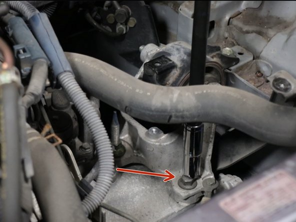 Remove the lower transmission bracket bolts.