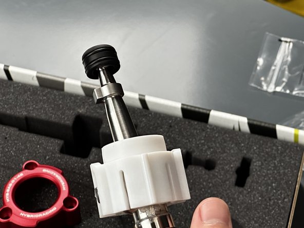 Locate the Shifter Ball Cup (#7) and snap it in place. This part should spin smoothly and freely.