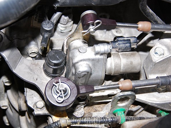 We will start from the underside of the car by feeding them up to the transmission side first then into the car on the shifter side.