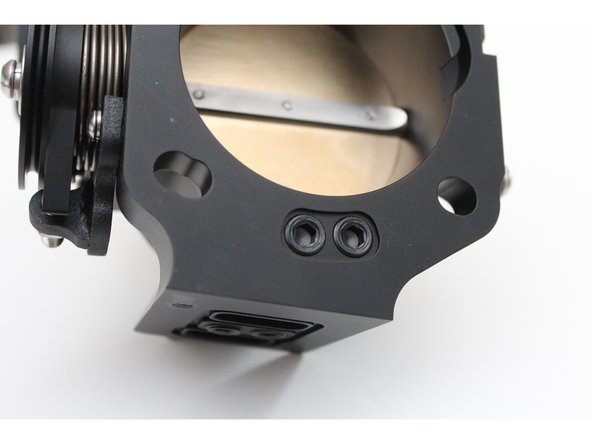 Make sure the plugs are threaded ALL the way in on the mounting face BEFORE mounting the housing to an intake manifold. If the plugs are not all the way down it can prevent a seal causing a vacuum leak.