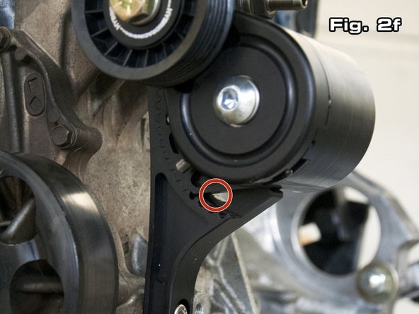 The autotensioner is supplied in its lowest position. Figure 2f shows how no open grooves are visible at the lower portion of the autotensioner. Figure 2g shows the autotensioner adjusted to its highest setting, where 4 grooves are showing. In the case of a k24, typically 2-3 grooves will need to show if the supplied belt is used.