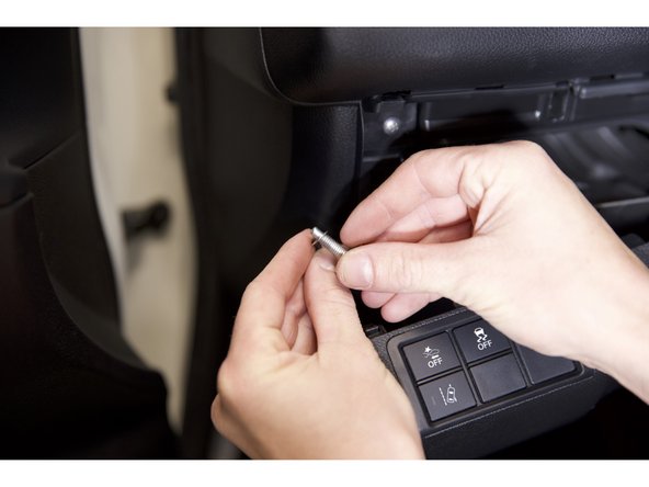 Remove the bolt, insert the bolt through the eyelet and reinstall the bolt.