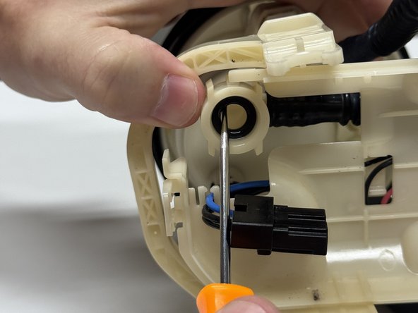 Inside the main housing, locate and remove the old o-ring.