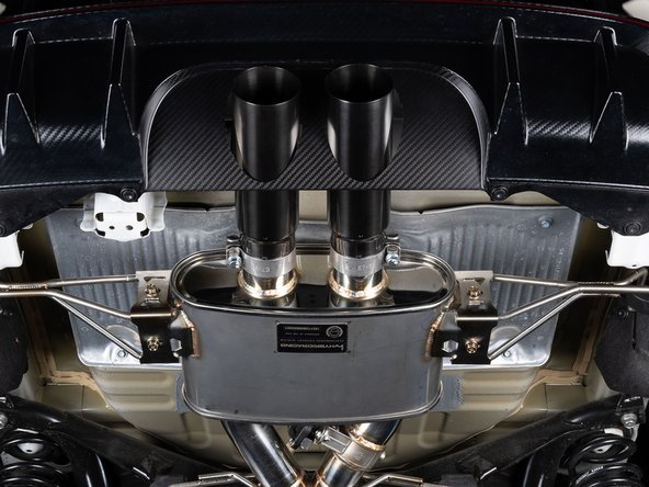 Once the hangers and pipes are tight, tighten the exhaust tips in alignment of the panel.