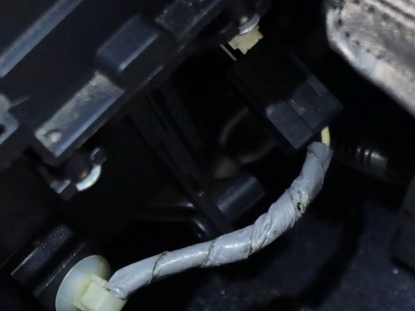 Unplug the 12v socket and remove the wire harness from the console.