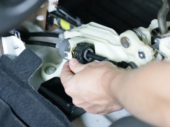 Remove the shifter cables.