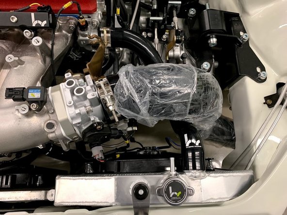 Use the supplied T-bolt clamp and attach the intake tube to the throttle body.