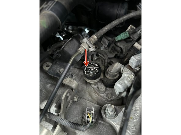 Remove the Cotter-Pin from cable on top of Transmission and slide the endlink off.