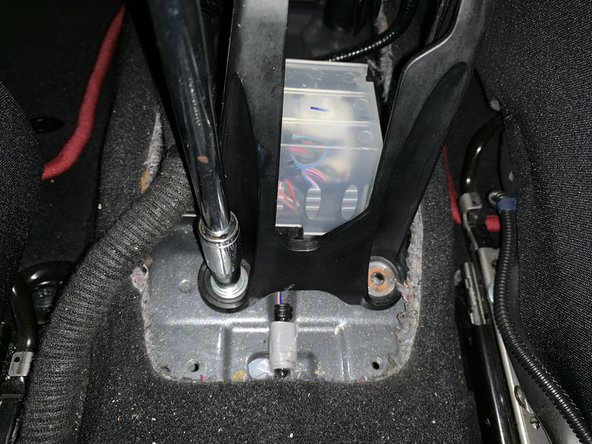Remove the x4 10mm bolts on the base of the factory shifter.