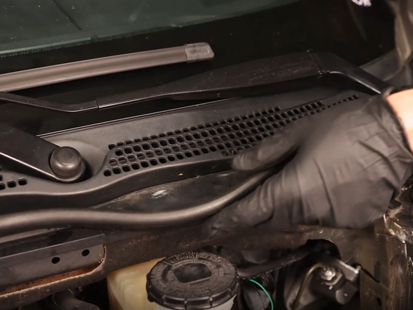 Remove the rubber cowl seal.