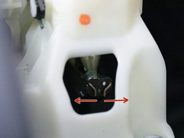 Remove the shifter cable from the shifter by spreading the metal clip apart and pulling it away from the shifter.