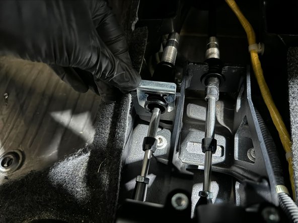 By hand, push cable clips into place.