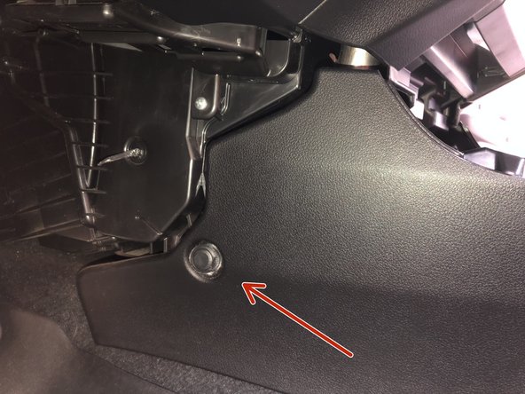 Using a plastic trim tool, remove the two push clips on the RH side and one on the LH side of the console. Set them to the side.