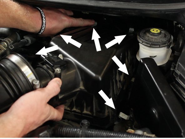 Unhinge the air box lid. There are six hinges total.