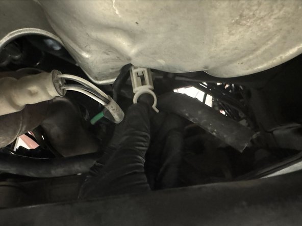 Clip oxygen sensor wires to black metal bracket.