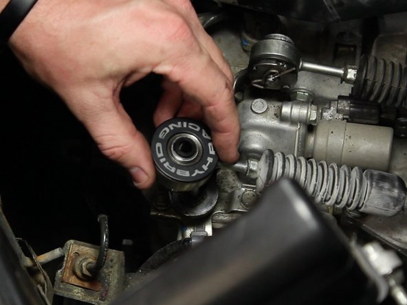 Install the Hybrid Racing bushing with the logo side up.