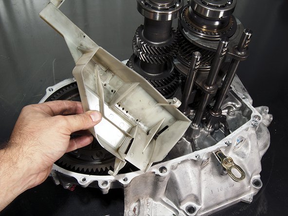 Remove the oil gutter plate. 