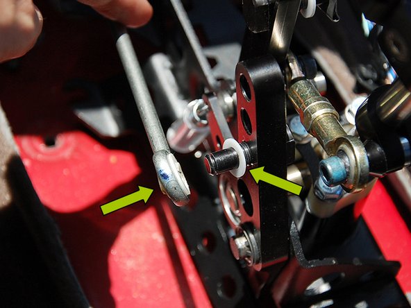 Slide (1) of the plastic washers supplied with the shifter on the left side shifter arm, then slide the left side shifter cable endlink onto the shifter arm (1st image).