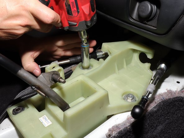 Remove the shifter from the inside of the car.