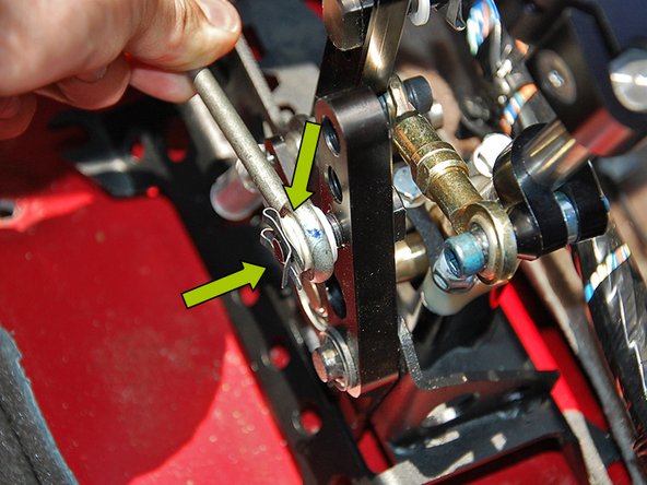 Secure the cable with another plastic washer and clip supplied with the shifter (2nd image).