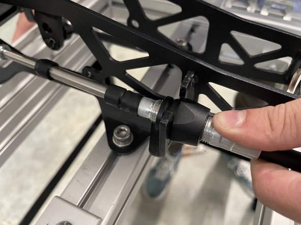 Install the cable through the shifter bracket.