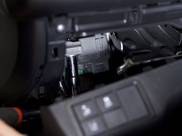 Behind the lower dash panel, there is a 10mm bolt that you can use to ground the EVC harness.