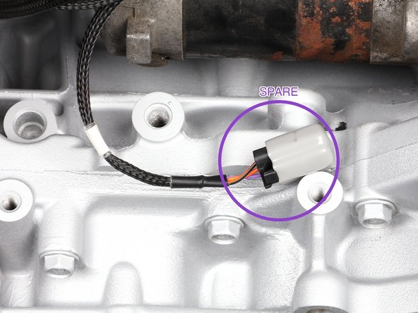 Route the cabin section through the firewall: an existing opening such as the heater core pass-through, the passenger side grommet where the fuse box wiring runs, or a hole you drill and grommet. Feed the small connectors through first and the big main connector (C101) last. Two people make this easy.