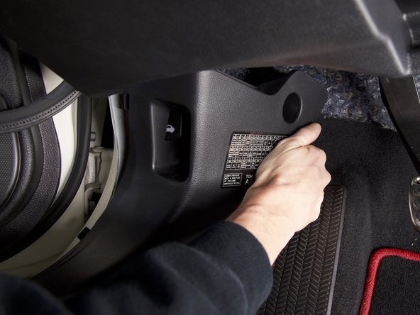 Route the wiring harness behind the kick panel and upwards toward the fuse box.