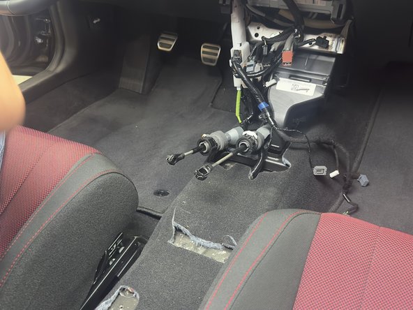 Install the Hybrid Racing shifter using the OEM hardware.