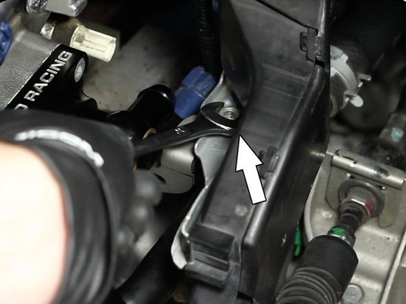 Bend the heat hose pipe mounting tab back into place and install the factory mounting bracket.