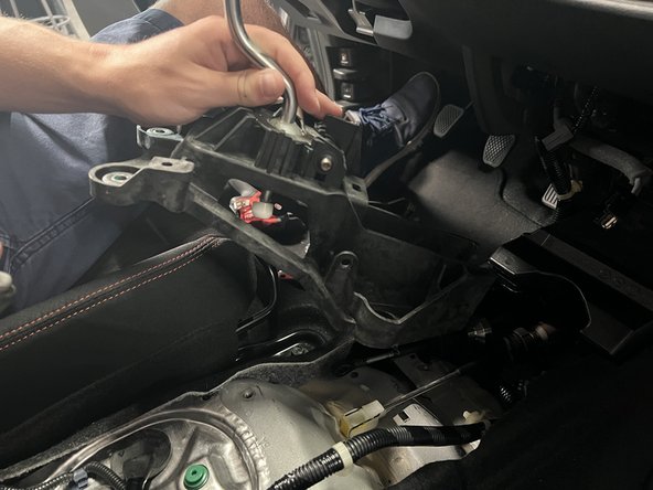 Remove the stock shifter cable from the chassis.