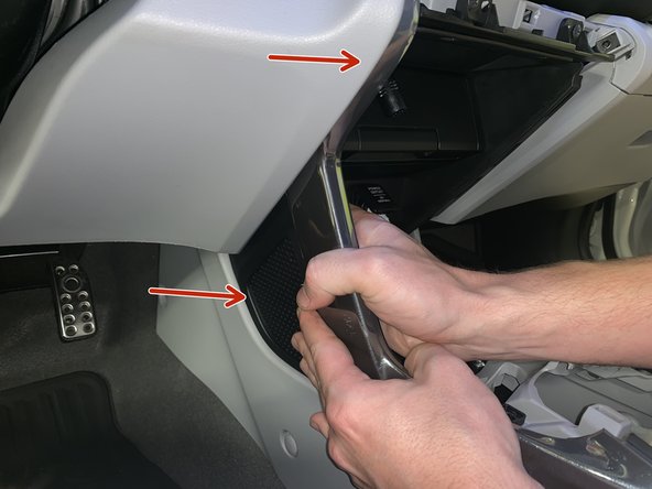 Using your hands, remove the side console trims. Once all of the screws have been removed, they just pop off.